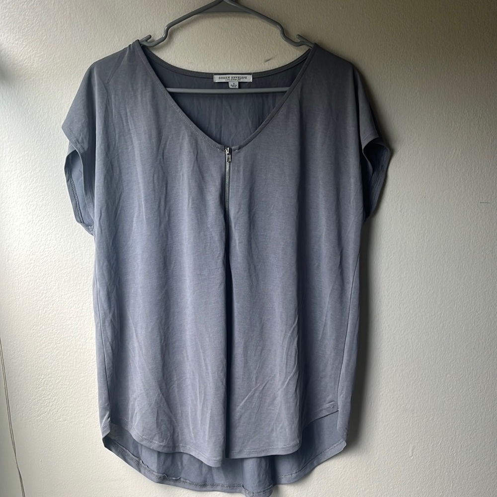 Gray top with the V-neck and Zipper detail on front